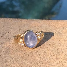 a close up of a ring on top of a stone