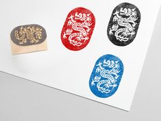 three rubber stamps with designs on them sitting on top of a piece of white paper