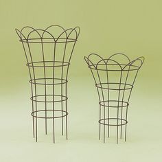 three wire vases sitting next to each other