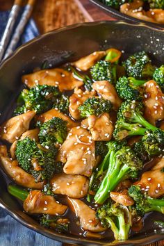 chicken and broccoli stir fry in a skillet with chopsticks on the side