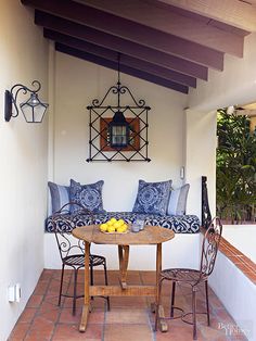 a table with fruit on top of it next to a couch