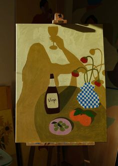 a painting on an easel with a woman holding a bottle