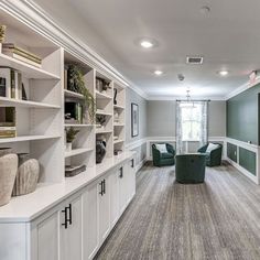 At Edgebrook Residences, this amenity space offers more than just functionality—it embodies refinement. Built-in shelving and cabinetry bring both form and purpose, while the lush green accents of the seating area enhance the natural tones throughout. Thoughtfully curated decor and sleek finishes create a calm, welcoming atmosphere that encourages productivity and relaxation in equal measure. #Studio59East #InteriorDesign #HomeDecor #InteriorStyling #DesignInspiration #Design #Decor #Interi... Amenity Space, Curated Decor, Green Accents, Gaming Room, Natural Tones, Lush Green, Seating Area, Design Decor, Interior Styling