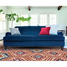 a living room filled with furniture and a rug