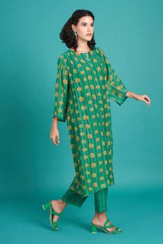 Emerald silk cotton mul fabric based kurta with floral vine prints. Comes with stripe print pant.
Components: 2
Pattern: Printed
Type Of Work: Floral
Neckline: Round
Sleeve Type: Three Quarter
Fabric: Mul Cotton Silk
Color: Green
Other Details: 
Closure: Kurta: Front buttons
Occasion: Work - Aza Fashions Print Pant, Pant For Women, Floral Vine, Printed Pants, Cotton Silk, Aza Fashion, Stripe Print, Silk Printing, Sleeve Type