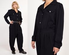 Vintage 80s black long sleeve jumpsuit with jeweled buttons down the bodice, a fitted waist with elastic at the back, and tapered legs. It has a zipper fly with two buttons at the waist, and decorative chest pockets. Shown modeled with a belt in the first two photos (not included with purchase).   Measurements and Condition: Fits like: Labeled size 13/14 tall (women's large tall) Fabric: Acetate/rayon - labeled dry clean only Brand: Avon Fashions, made in USA Condition: Excellent Length: 63" Chest: 41.5" Waist: 27" to 33" - stretches with elastic at back  Hips: 46" - taken at the bottom of the zipper opening Rise to waist: 15" Inseam: 32" Shoulders (seam to seam): 16" Sleeve: 24" Cuff: 8.5" Shown on a 5'7" model with measurements of 37"-30"-39.5", usually wears a size medium. See our FAQ f Black Long Sleeve Jumpsuit With Button Closure, Vintage Long Sleeve Jumpsuit For Work, Vintage Long Sleeve Jumpsuits And Rompers For Work, Retro Long Sleeve Jumpsuit For Fall, Vintage Long Sleeve Jumpsuits And Rompers For Fall, Retro Long Sleeve Jumpsuits And Rompers For Fall, Black Long Sleeve Jumpsuit, Button Up Jumpsuit, Jumpsuit Vintage