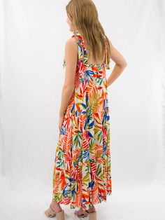 The perfect resort dress exists. Our bright palm leaf maxi dress features tie shoulders and a ruffle hemline. We love a bright pallet for summer! SIZE & FIT Fit is true to size Model is 5'6" wearing size small Vibrant Green Tropical Print Maxi Dress, Tropical Print Sundress For Vacation, Multicolor Tiered Maxi Dress For Beach, Tropical Sundress With Tropical Print For Vacation, Tropical Sundress For Beach Party, Tropical Multicolor Dress With Palm Tree Print, Tropical Multicolor Palm Tree Print Dresses, Summer Multicolor Maxi Dress With Tie Straps, Tropical Print Maxi Sundress