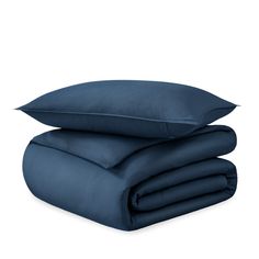 two pillows and one pillow are stacked on top of each other