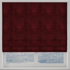 a red roman blind in front of a window