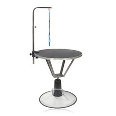 a round table with a blue handle on it's end and an umbrella hook attached to the top