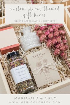 a gift box filled with flowers and other items