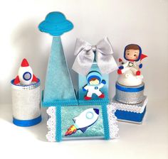 an assortment of toy items are displayed on a white surface with space related objects in the foreground