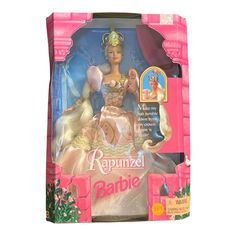 the barbie princess doll is in its pink box and has a tiara on her head