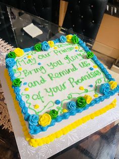 a sheet cake with blue and yellow frosting