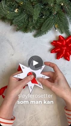 someone is making a paper star ornament