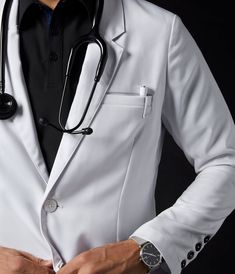 a male doctor in a white suit with a stethoscope on his chest