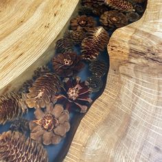 some pine cones are laying on top of a table