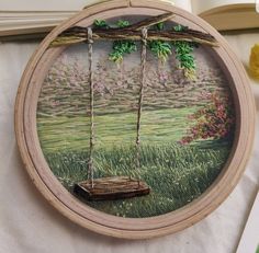 a wooden frame with a swing hanging from it