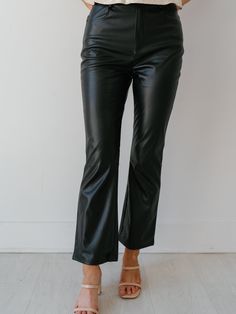 Leather pants are simply a must have piece for the fall! The "Business Chic Flare Cropped Pants" offer a sophisticated approach to styling outfits. They feature a fit and flare design that is both flattering and on trend. The flared ankles and cropped length make these pants ideal for styling with heels or sneakers! Detailed Fit: High rise faux leather pant Ankle fit length Kick flare at the bottom of pant Overall Fit: Fitted with some stretch Sizing: True to size Fabric: 100% polyurethane Measu Cropped Faux Leather Pants Outfit, Faux Leather Pants Outfit, Styling Outfits, Leather Pants Outfit, Business Chic, Leather Pant, Kick Flares, Pants Large, Faux Leather Pants