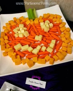 carrots and celery arranged in the shape of a heart on a plate