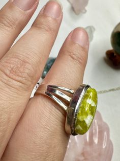 🌟 Welcome to Shine Bright Crystals! 🌟 Stay in the loop with our latest arrivals and thrilling giveaways by following us on Instagram: @ShineBrightCrystals 📏 Approximate Size: 8 Discover the allure of our handcrafted Lizardite sterling silver ring, size 8. This unique green gemstone jewelry piece is perfect for adding a touch of elegance to any outfit. Ideal as a statement ring or a thoughtful gift for her, this natural stone ring is designed to impress. 🌟 Handcrafted Design: Each ring is meticulously crafted to highlight the natural beauty of the Lizardite gemstone. 💚 Unique Green Gemstone: The Lizardite stone features a stunning green hue, making each ring one-of-a-kind. 👗 Elegant Statement Piece: Perfect for special occasions or everyday wear, this ring adds a sophisticated touch t Handmade Adjustable Oval Crystal Ring, Adjustable Green Rings With Large Stone, Adjustable Green Crystal Gemstone Ring, Adjustable Green Ring With Large Stone, Adjustable Green Jewelry With Large Stone, Handmade Green Crystal Ring For Healing, Green Crystal Ring With Large Stone For Gift, Adjustable Green Turquoise Ring As Gift, Adjustable Green Turquoise Ring Gift