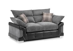 a black and grey couch with pillows on it's back end, in front of a white background