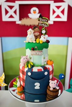 a birthday cake with farm animals on it