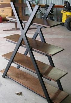 three wooden shelves sitting next to each other in a garage