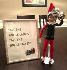 an elf is standing next to a sign that says, all the jungle ladies'all the jungle ladies '