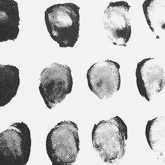 an image of fingerprints in different shapes and sizes on a white paper background