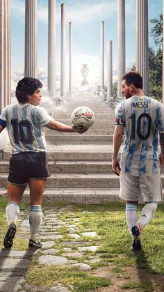 two soccer players are holding a ball in front of some columns