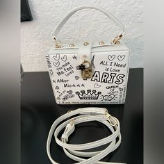 Pop Art White Paris Theme Sam Forever Crossbody Bag With Adjustable And Detachable Strap And Gold Tone Hardware. The Roomy Interior Has An Open Compartment. There Are A Few Smudged Areas ( See Pics) Price Reflects This. This Is One Of A Kind. Nwot Trendy White Square Box Bag, White Box Bag With Detachable Handle, White Box Bag With Top Carry Handle For Travel, White Top Handle Box Bag With Adjustable Strap, White Square Box Bag With Removable Pouch, White Box Shoulder Bag With Adjustable Strap, Trendy White Rectangular Box Bag, White Shoulder Box Bag With Adjustable Strap, White Shoulder Box Bag With Top Carry Handle