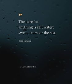 a quote on the ocean with rain drops