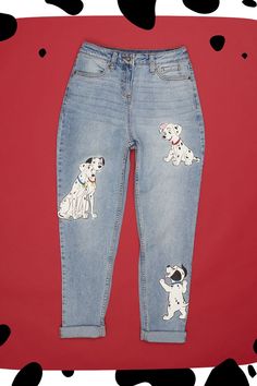 From 101 Dalmatians, these light indigo wash mom jeans features printed graphics of Pongo and Perdita sitting together on one leg, plus some playful pups on the other. And looks like your favorite dogs have left some paw prints on the back pocket! Pongo And Perdita, Disney Pants, Sitting Together, Nerdy Shirts, Disney World Outfits, Disney 101 Dalmatians, Disney Dogs, Dream Outfits, Her Universe