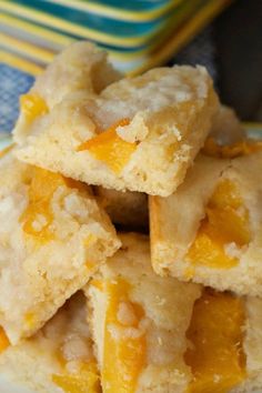 a pile of orange squares sitting on top of a white plate