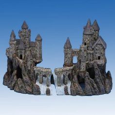 a castle made out of rocks on a blue background