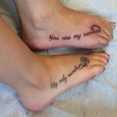 two people with tattoos on their feet that say you are my sunshine