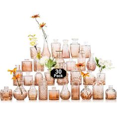 there are many different vases and flowers in this display case with the price tag 30 pack