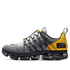 the nike air vapor plus is in grey and yellow with black detailing on the upper part