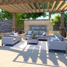 an outdoor living area with couches, tables and chairs under a pergolated roof