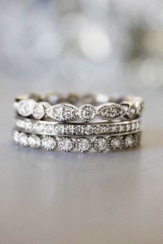 three wedding bands with diamonds on them