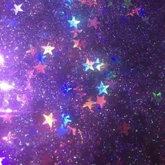 the stars are all over the ground in purple and blue