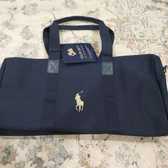 Brand New. Great Size. Has Zipper. Blue Duffle Bag With Zipper Closure For On-the-go, Navy Shoulder Bag With Dust Bag For Travel, Blue Duffle Bag With Zipper Closure, Everyday Blue Duffle Bag With Zipper Closure, Blue Casual Tote Duffle Bag, Casual Blue Tote Duffle Bag, Casual Blue Duffle Bag With Zipper, Canvas Duffle Bag, Ralph Lauren Bags