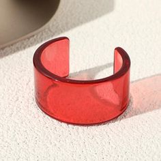 Transparent Color Acrylic Wide Open Bangle - SHExFAB Red Plastic Party Jewelry, Trendy Red Plastic Bracelet, Trendy Red Bracelets For Party, Trendy Red Plastic Bracelets, Trendy Red Bangle Jewelry, Adjustable Red Cuff Bracelet As Gift, Trendy Red Plastic Jewelry, Red Summer Bracelet Jewelry, Red Bracelet Jewelry For Summer