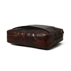 Experience sophistication with our glossy reddish brown leather briefcase. Perfectly sized for laptops and work essentials, this unique accessory makes a stylish statement in any setting, from the boardroom to the classroom. Its distinctive reddish-brown color sets it apart, making a stylish and memorable impression wherever you take it. The elegant reddish brown leather briefcase is the perfect stylish work companion. This briefcase isn't just functional; it's a statement piece that reflects yo Classic Laptop Bag With Sleeve For Business Meetings, Rectangular Briefcase With Laptop Sleeve For Business, Rectangular Briefcase With Laptop Sleeve For Business Meetings, Red Rectangular Briefcase For Business, Classic Vintage Brown Rectangular Briefcase, Classic Brown Rectangular Briefcase, Brown Rectangular Briefcase With Luggage Sleeve, Modern Brown Bag For Business Meetings, Classic Briefcase With Laptop Sleeve For Business Meetings