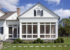 a large white house with lots of windows