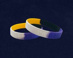 These non-binary pride silicone bracelets are yellow, black, white and purple swirled together which are the colors of non-binary awareness. These bracelets are made of high quality 100% silicone that you can see and feel. The yellow, black, white and purple bracelets are embossed with the word PRIDE and are approximately 8 inches in circumference in size. These inexpensive bracelets are perfect whether buying 1 or 100. Purple Bracelets, Gay Pride Bracelet, Non Binary Flag, Nonbinary Flag, Non Binary Pride, Silicone Bra, Pride Bracelet, Ways To Show Love, Purple Swirl