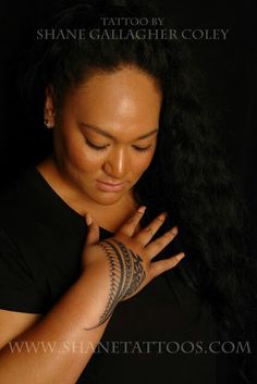 a woman with tattoos on her arm