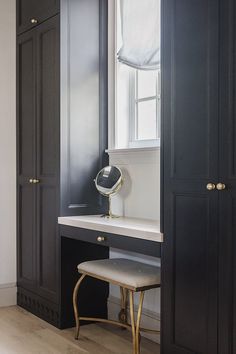 a black and white dressing room with an armoire