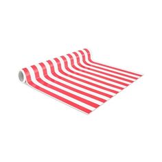 a roll of red and white striped paper